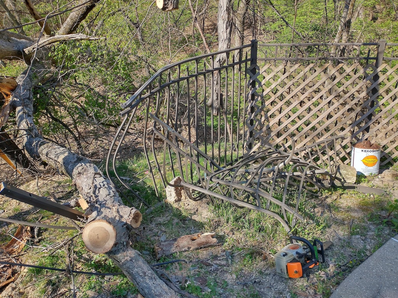 Damaged fenced caused by a neighbor's tree falling during a storm